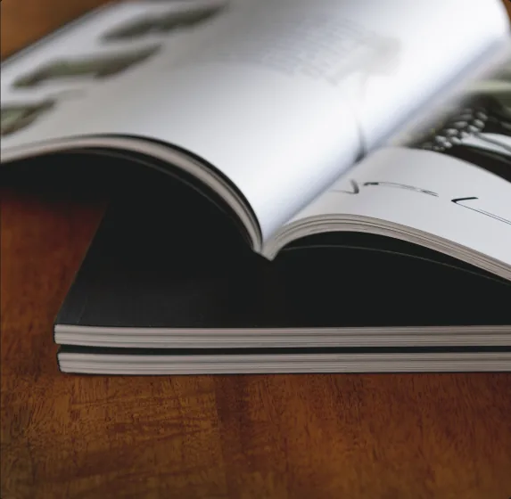 Dusty Times open book showing the perfect binding and heavy paper